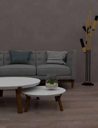 A stylish modern living room with a sofa, chairs, tables, and a unique floor lamp.