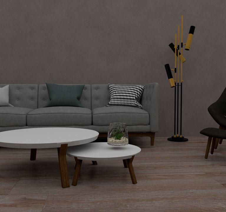 A stylish modern living room with a sofa, chairs, tables, and a unique floor lamp.