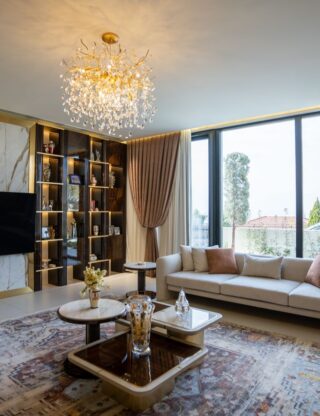 Luxurious modern living room with chandelier and large windows in Sulaymaniyah, Kurdistan.