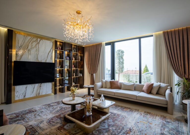 Luxurious modern living room with chandelier and large windows in Sulaymaniyah, Kurdistan.