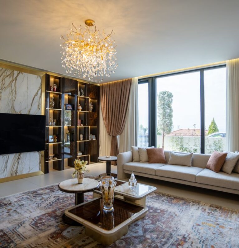 Luxurious modern living room with chandelier and large windows in Sulaymaniyah, Kurdistan.